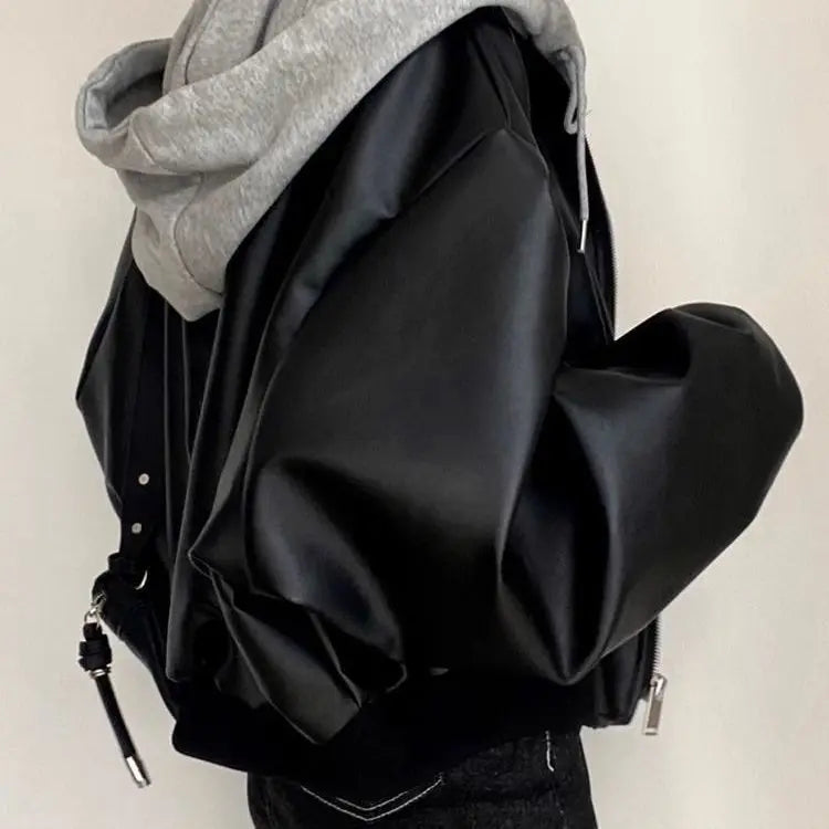 Chaqueta coreana de cuero PU negro de gama alta para mujer, moda holgada con capucha para primavera y otoño, ropa de abrigo versátil falsa de dos piezas con cremallera